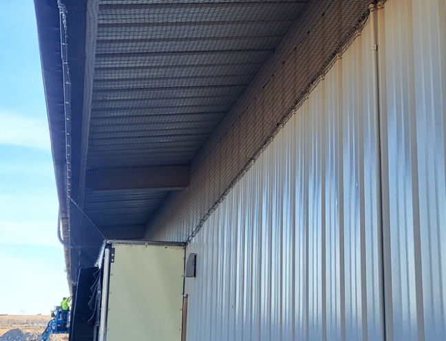 Protective net system installed in a building worksite to prevent bird intrusion