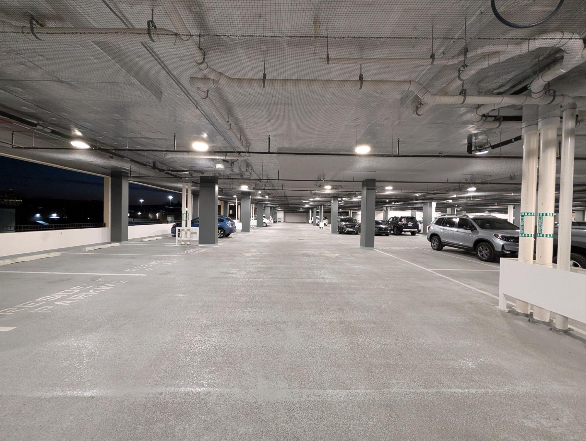 Bird netting installed on a commercial parking lot ceiling for effective pigeon control