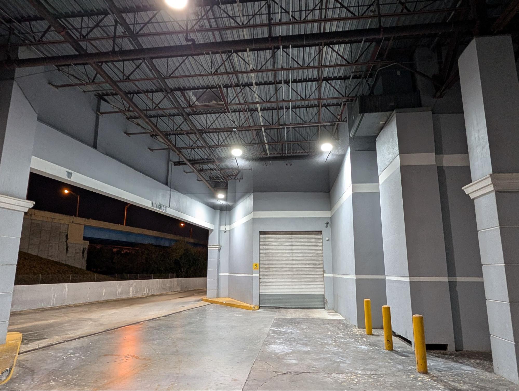 Commercial loading dock with overhead bird netting installed to prevent bird entry and roosting
